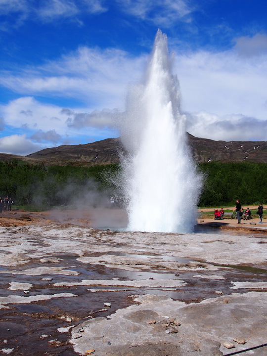 Strokkur geyser erupting at Geyser in Iceland